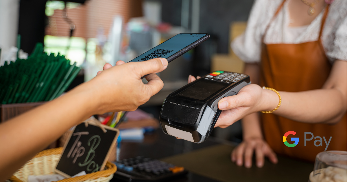 person paying with mobile device through either google pay or apple pay.